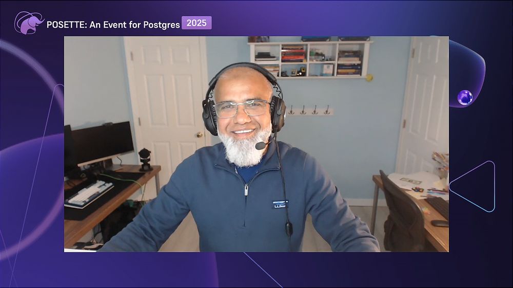 A person wearing headphones and a blue jacket, seated in a room with light blue walls. Behind them are shelves with books and items, and two closed white doors. A desk with a computer monitor and keyboard is on the left, and another desk with various items is on the right. The top of the image displays the text 'POSETTE: An Event for Postgres 2025' in white on a purple background.