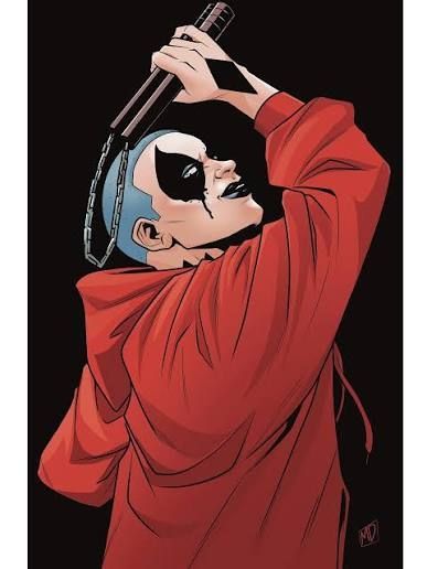 Harley with her arm up holding nun-chucks in her over sized red hoodie. Black out diamonds painted on her face with what looks like tears on the low points. 