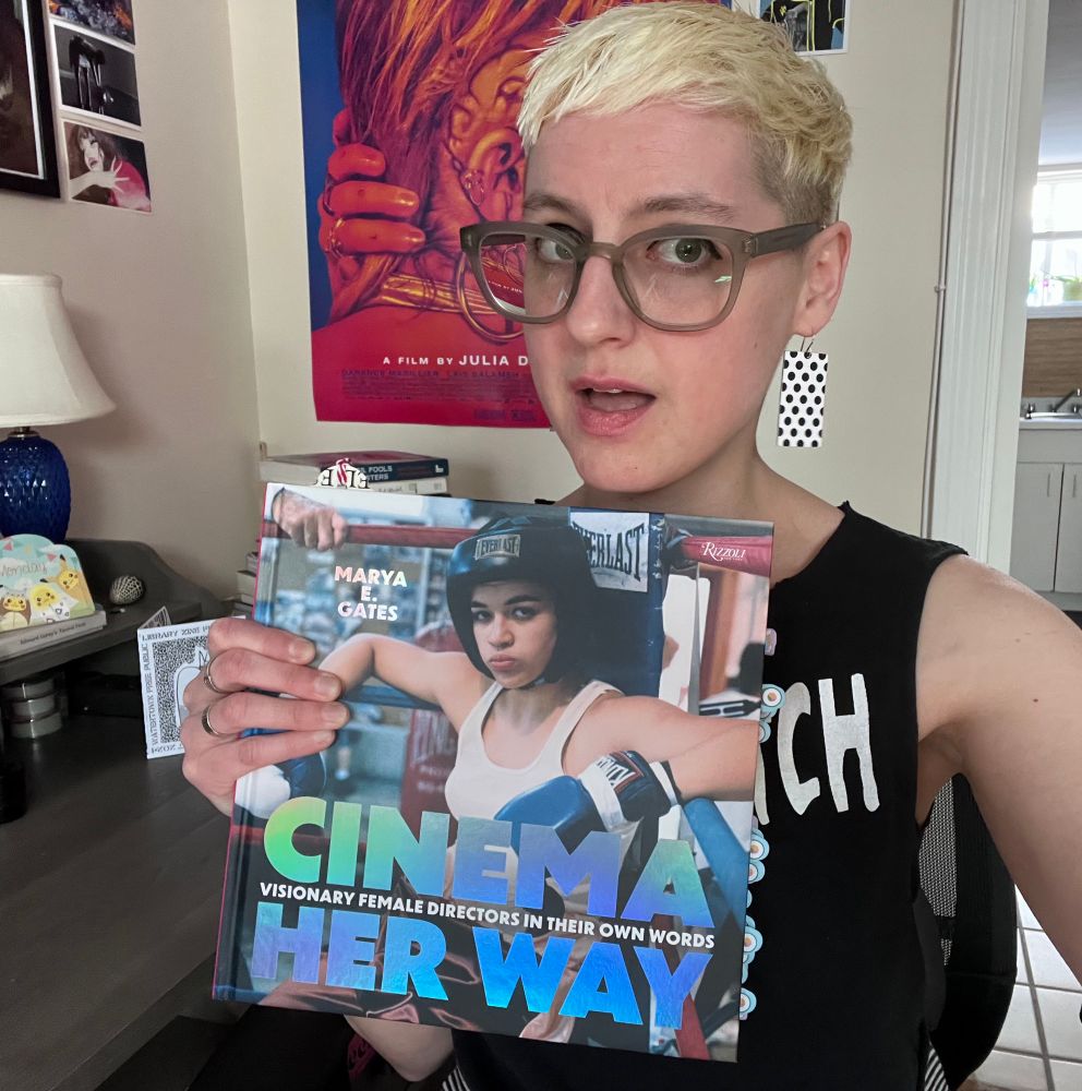 Me holding my copy of the BEAUTIFUL book, Cinema Her Way. 