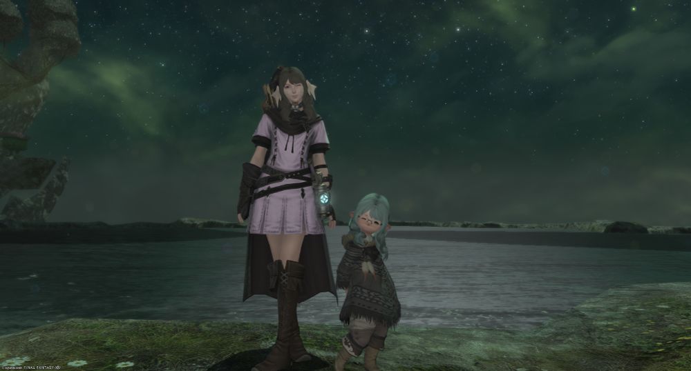 A screenshot of Final Fantasy XIV taken in group pose. A female Au'ra and Lalafell pose side-by-side in front of a lake.