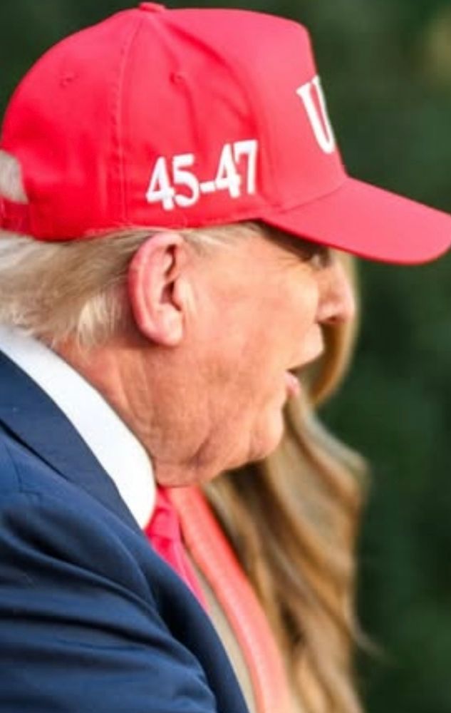 Close up photo of President 47 showing his right ear is undamaged by sniper shot. 