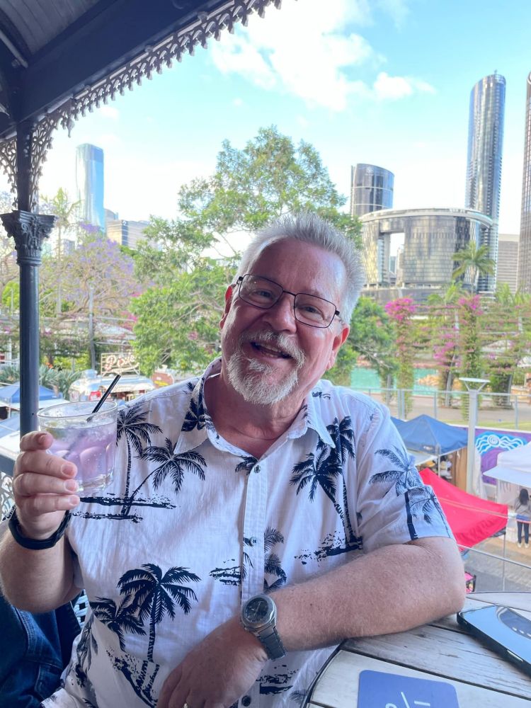 Holding a glass of Gin and Tonic, sat on the balcony at one of Brisbane's classic pubs.