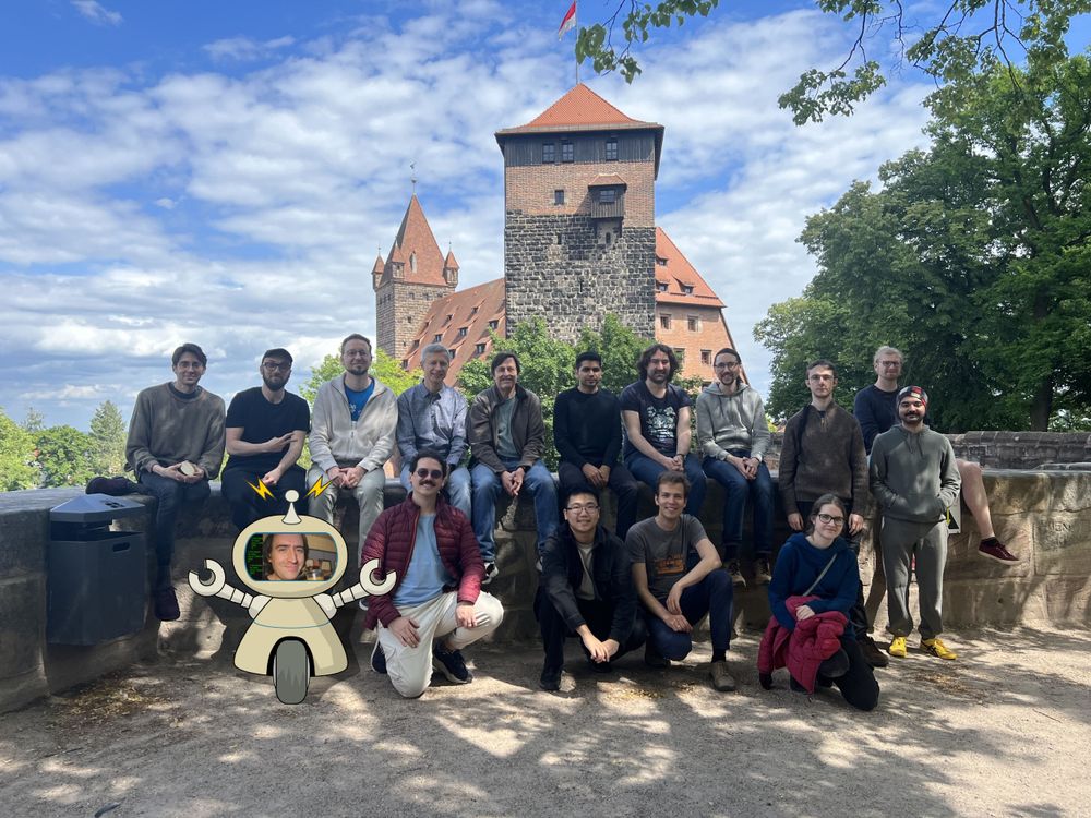 Group photo of (most) summit participants in front of a castle