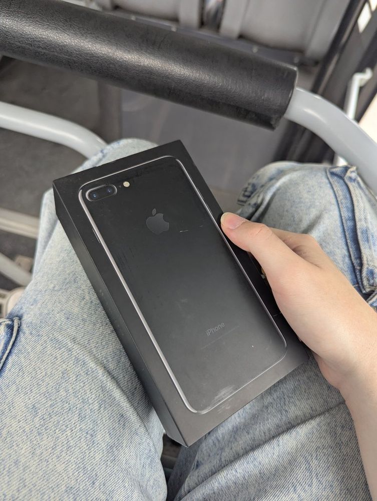 Me holding a boxed iPhone 7 plus jet black 256 GB on da bus 