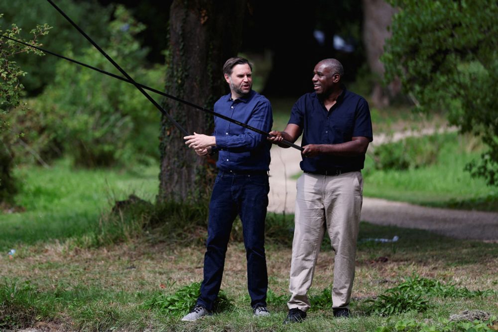 JD Vance and David Lammy pretending to do serious angling despite having absolutely no fishing tackle other than a stupid carbon rod each. The twats.