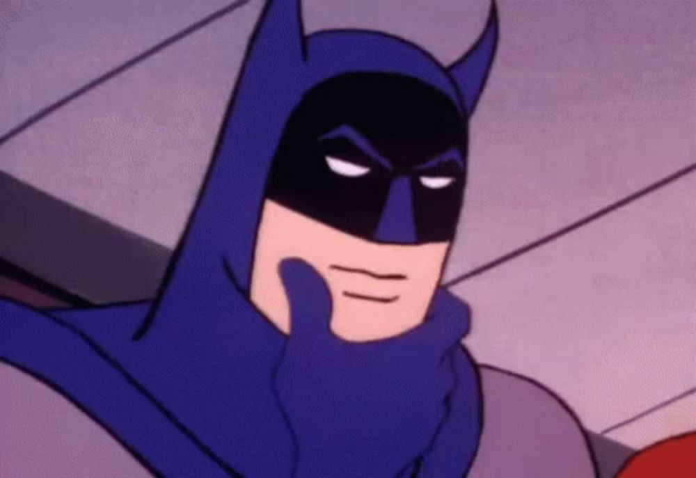 a close up of a cartoon batman with his hand on his chin