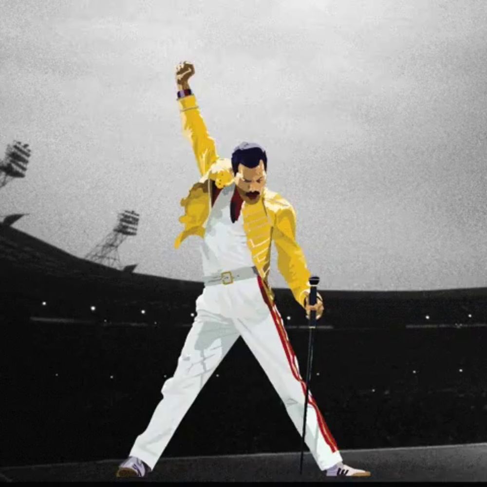 a man in a yellow jacket and white pants is holding a microphone