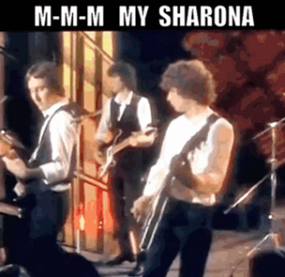 a group of men are playing guitars on a stage with the words m-m-m my sharona above them .