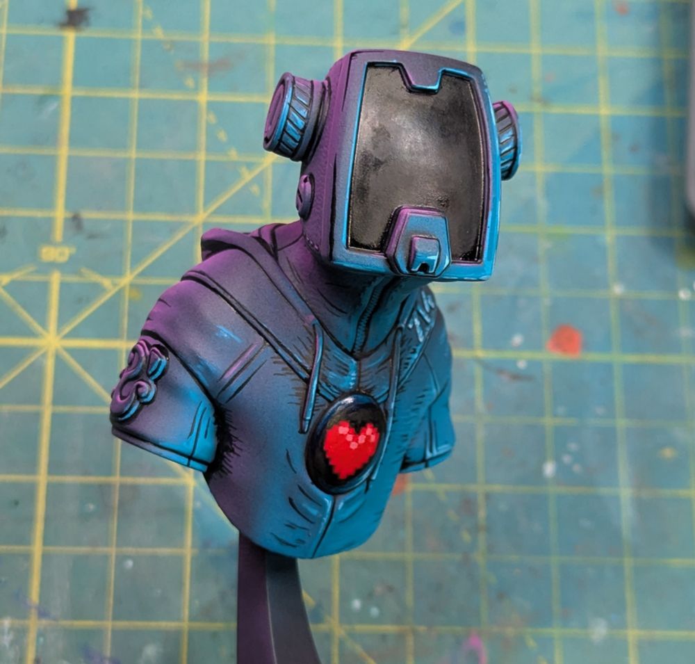 A bust of a man in a hoodie and cyberpunk visor; a round display with an 8 bit heart is located in the middle of his chest.