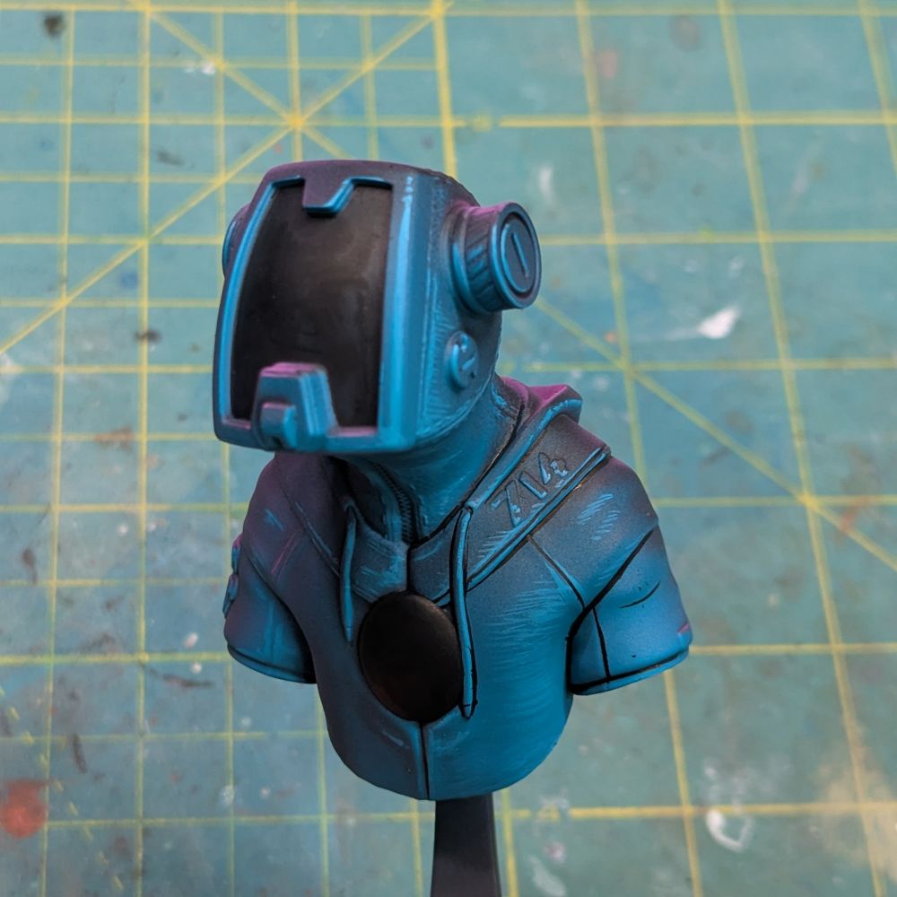 Painting has begun! A turquoise light illuminates the bust from the lower right, while a magenta light hits the back upper left in opposition. Some comic style black lining is done.