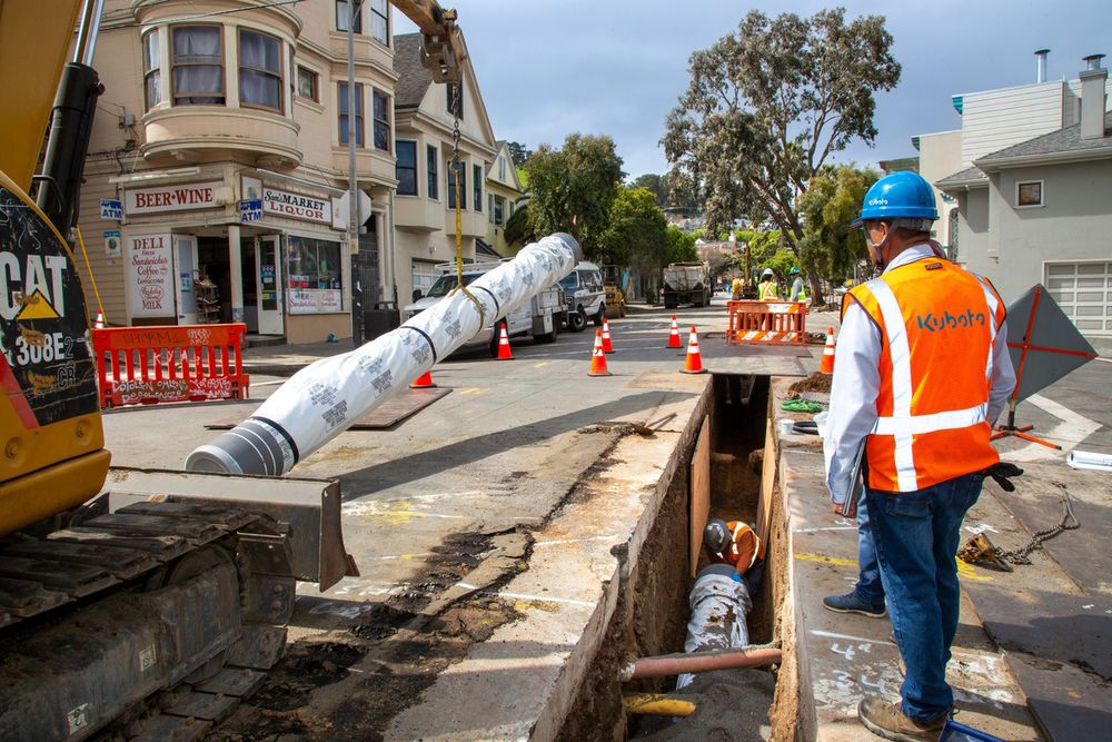 Crews installing Kubota pipes.