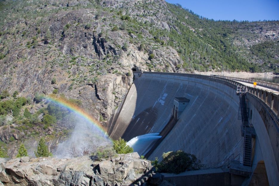 Water flowing out of O'Shaughnessy Dam at Hetch Hetchy with a rainbow.