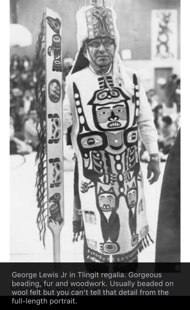 George Lewis Jr in Tlingit regalia. Gorgeous beading, fur and woodwork. Usually beaded on wool felt but you can’t tell that detail from the full length portrait.