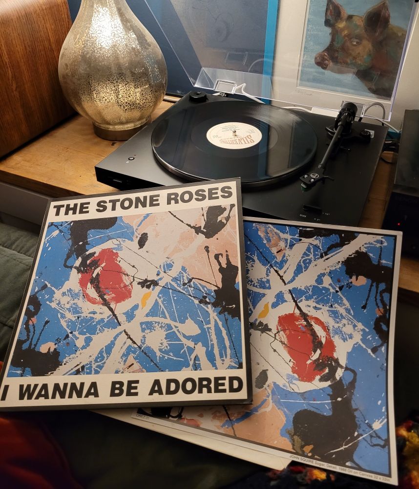 A 12" copy of I Wanna Be Adored by The Stone Roses being played