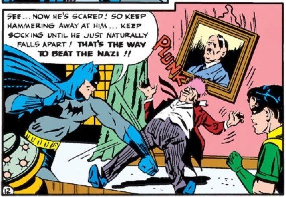 Viñeta de un cómic de Batman, supongo que de Detective Comics, donde Batman golpea a un nazi, estampándolo contra un retrato de Hitler. Obra de Bob Kane.
