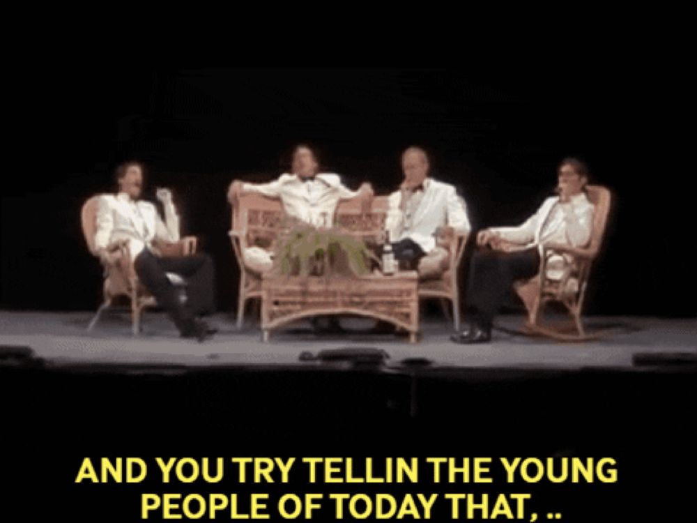 a group of men sitting on a couch with the words " and you try tellin the young people of today that "