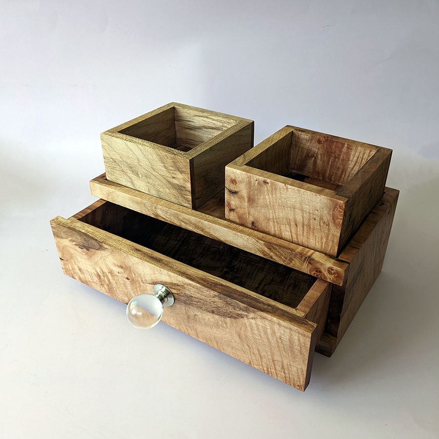 Desktop/Nightstand Organizer with Single Drawer and internal removable trays
Exterior Dimensions: 11" x 5.5" x 4"
Top built in tray-internal: 10.75" x 4.75" x 0.25"
Drawer-Internal: 9.5" x 4.5" x 2.5"
Small Drawer Trays: 3.375" x 3.675"

An organizer for your desktop or nightstand and designed with those needs in mind. Built to accommodate watches, fountain pens, pill organizers, combs, within while providing a stable surface up top for phone chargers, glasses, jewelry etc. Top lip prevents small items from falling onto the floor. Internal trays can be removed entirely if you desire the full drawer space. The trays can also sit on the top of the organizer and act as catch alls.