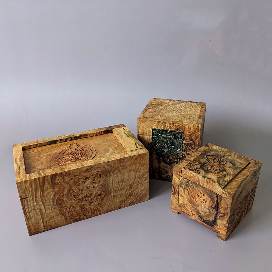 Ridiculously pretty burled maple boxes with spalting just checks all the boxes wow also with various warning engravings except for the chest one which is just a good little cursed chest friend