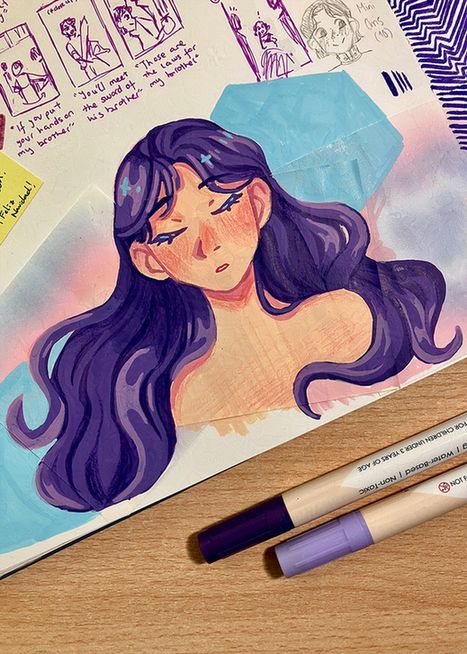 Photo of a page in my sketchbook, it features a colored sketch of a white girl with really long, wavy hair. She has a calm expression on her face, I tried to go for a very ethereal vibe and the overall aesthetic is really inspired by space/a galaxy. She has purple hair and I added little blue highlights in the shape of stars. The drawing sits over two blue, purple and pink colored post-its, which help me to set the desired vibe. Below the drawing, you can see two of the markers i used to color the drawing. They are acrylic markers from the brand Grabie