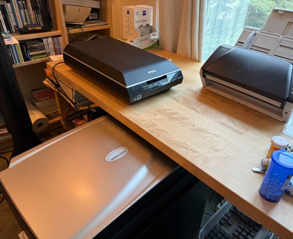Three scanners, a plustek OpticBook A300 Plus, Fujitsu fi-7480, and Epson Perfection v550
