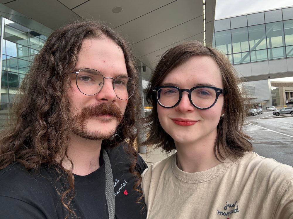Joey and Michael at the airport in matching Just Married shirts. Joey is distraught but Michael is very brave. 
