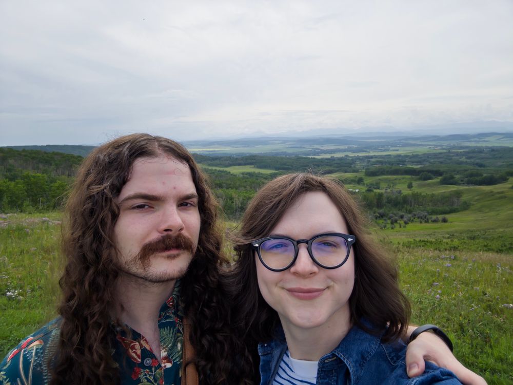 Joey and Michael in front of the Alberta foothills. 