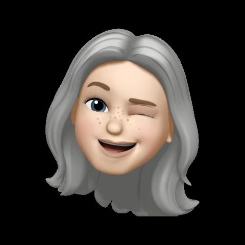 Gray haired lady winking. 