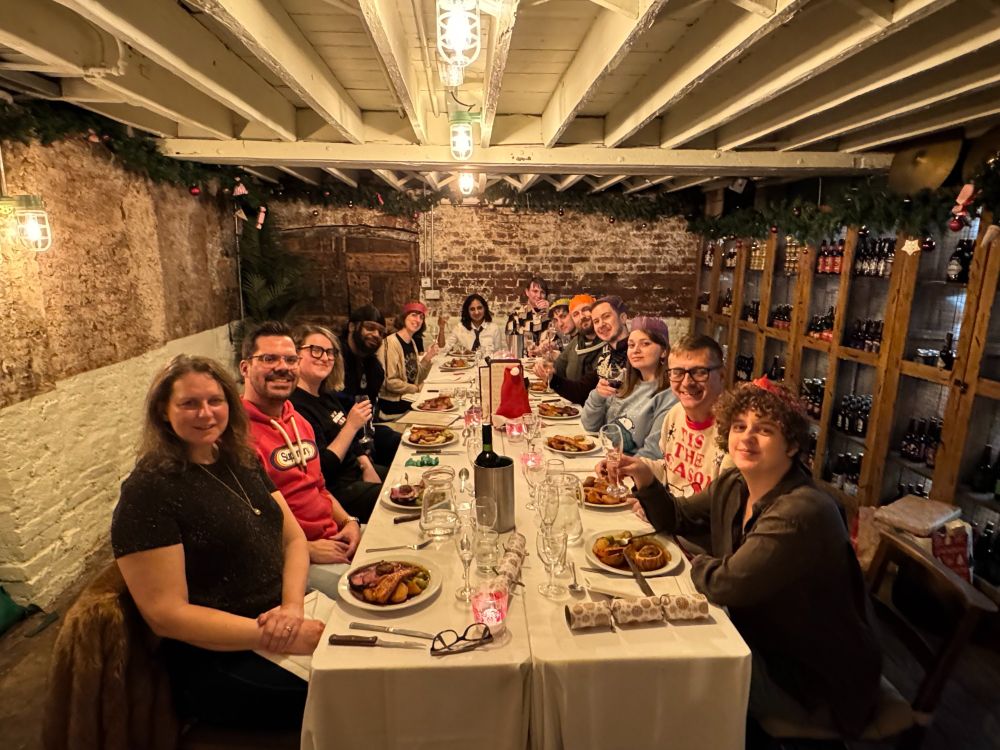 Team shot around the table for Christmas Dinner.