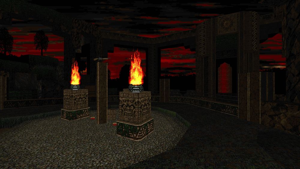 a cliffside illuminated by torchlight... in the distance. you see towers and aqueducts.
