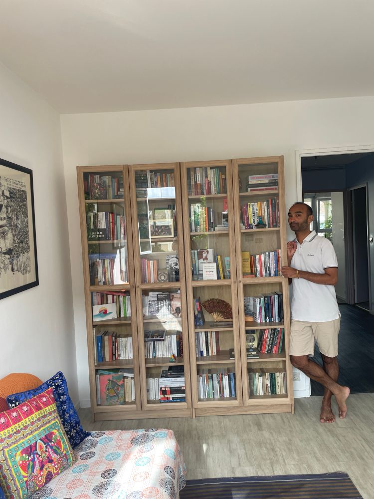 Me posing with the new bookshelf