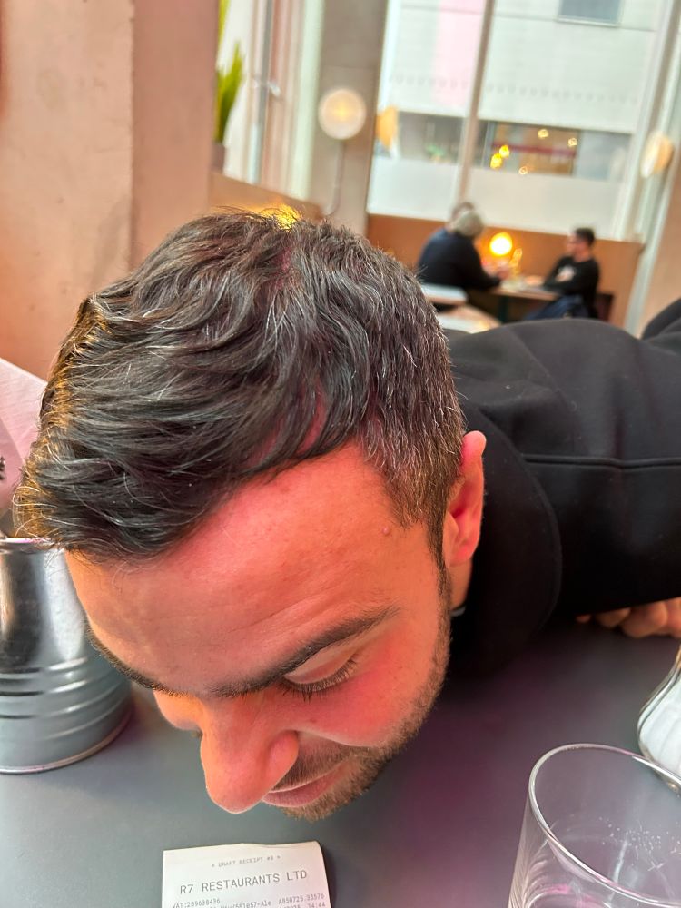 Ben Starr sniffs at a restaurant receipt like a fucking goblin