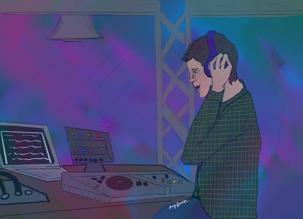 A man, Dean Winchester standing behind a DJ turn table in a club.