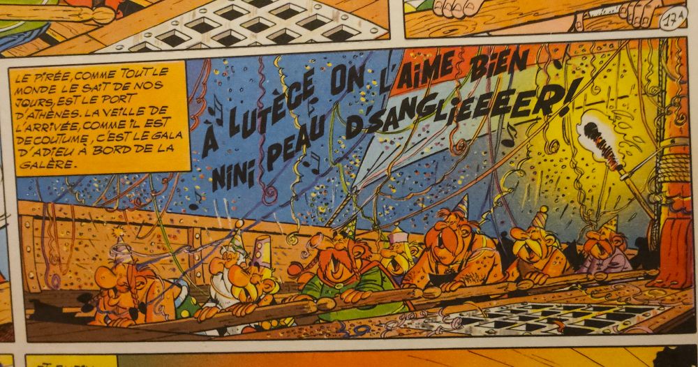 Sur la galère,  les Gaulois rament en chantant aux milieu de cotillons. La scène se passe de nuit et est entièrement éclairée à la torche