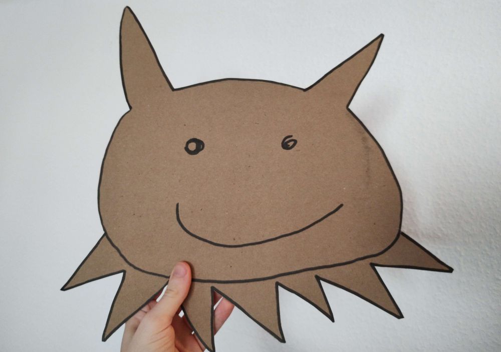 A large cardboard cutout of the head of some sort of creature