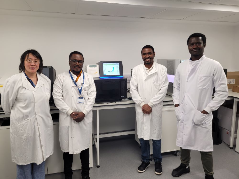 Sequencing success! David, Andrew, and Fredy celebrate a smooth run on the NextSeq 500 with the Glasgow team.