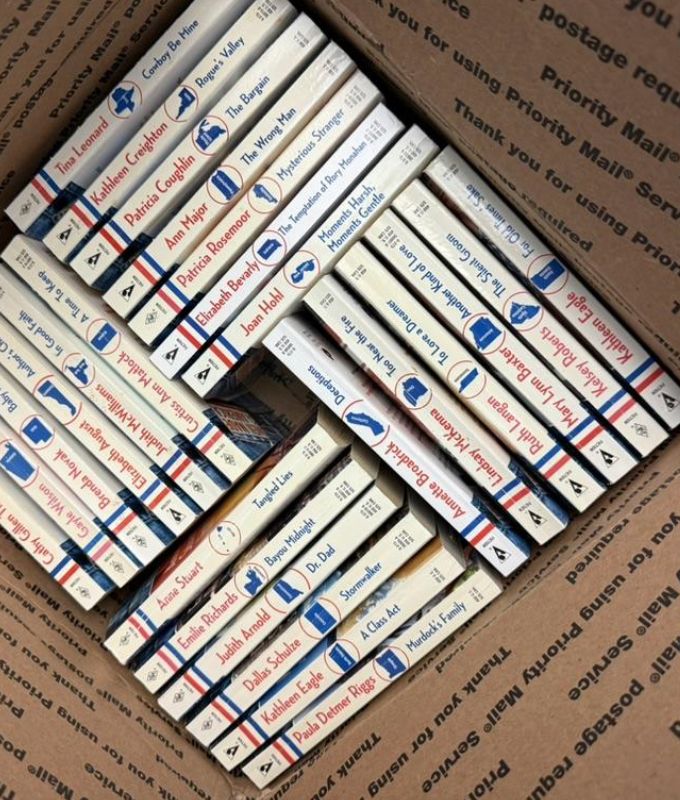 Box of paper back books of the Harlequin Man Made in America series