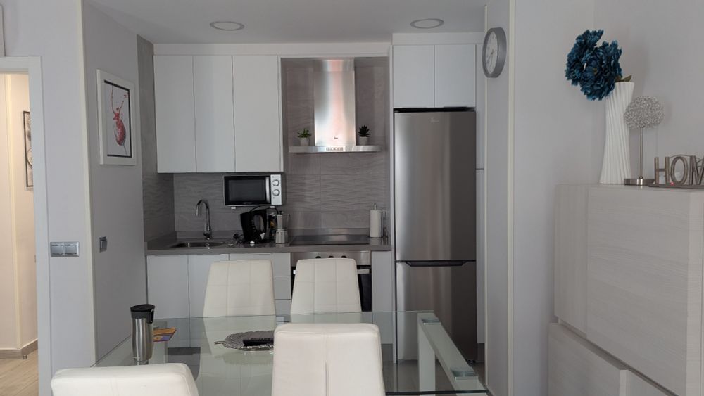 Full kitchen with stove/oven, stainless steel full-sized fridge