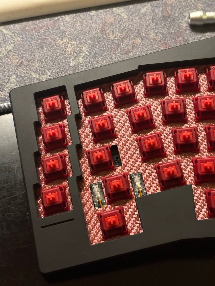another photo of Type-K with red Gateron Type-R switches on red carbon fiber
