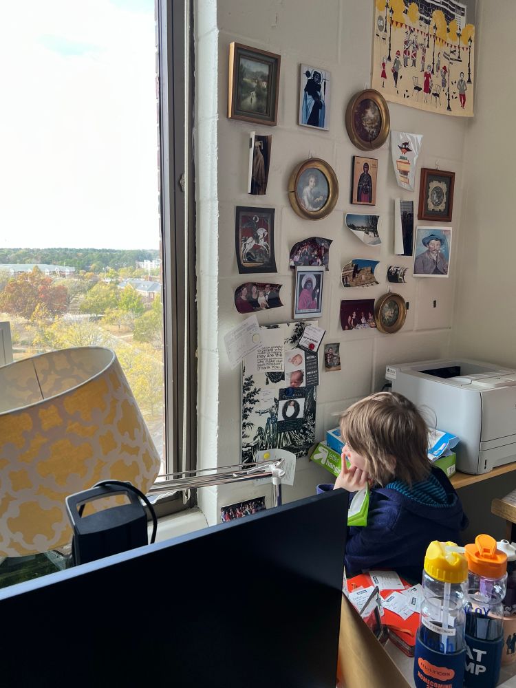 A small boy in an English professor’s office, looking out.