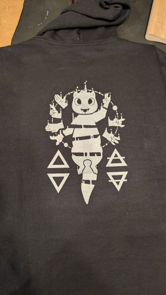 The quoted image printed on the back of a black hoodie