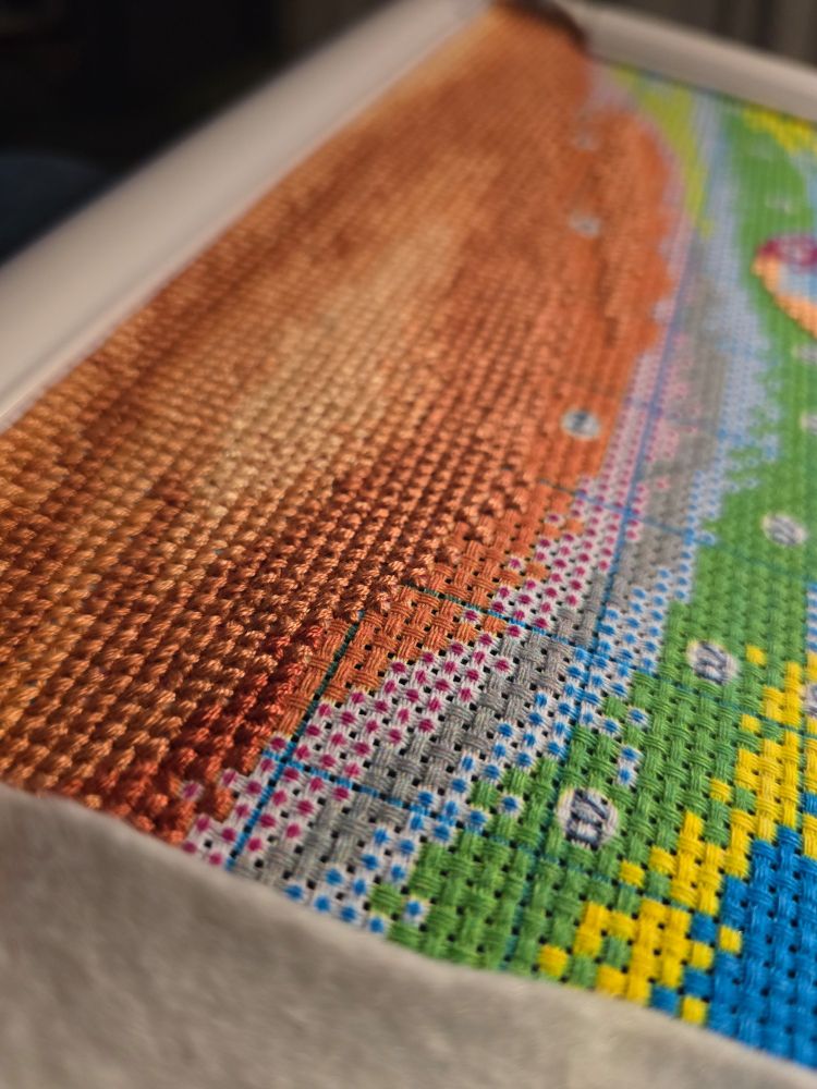 Orange sky scene of a stamped cross stitch kit. Just getting started so a long way to go. #craftsky #crossstitch #stitchsky