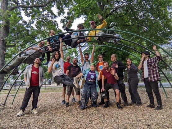 Adults on a playground, worrying about it collapsing under their weight