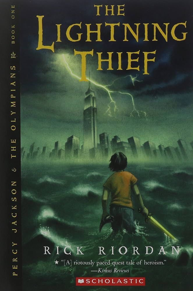Cover for the novel “Percy Jackson and The Lighting Thief” by Rick Riordan. It shows a boy with a golden sword. He’s standing inside a body of water, overlooking New York