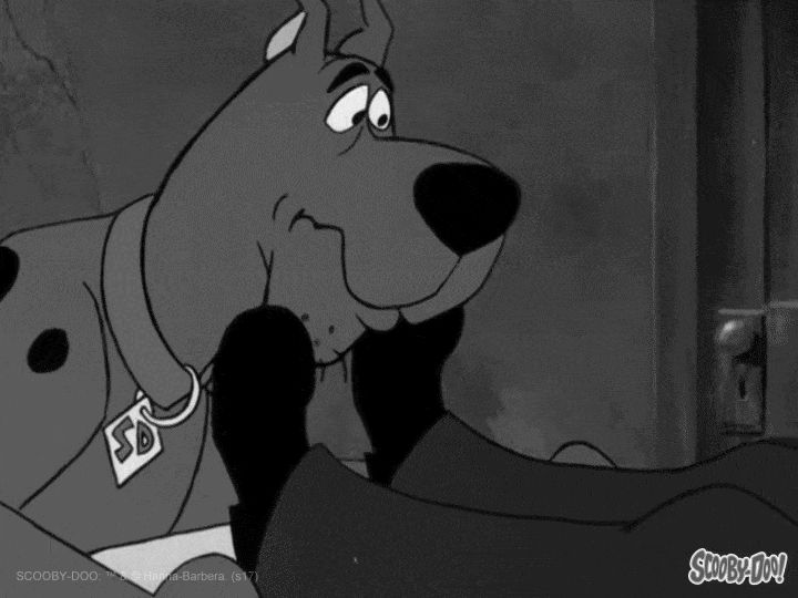 Scooby cracking a smile at Shaggy. They grin as they both get almost taken away 