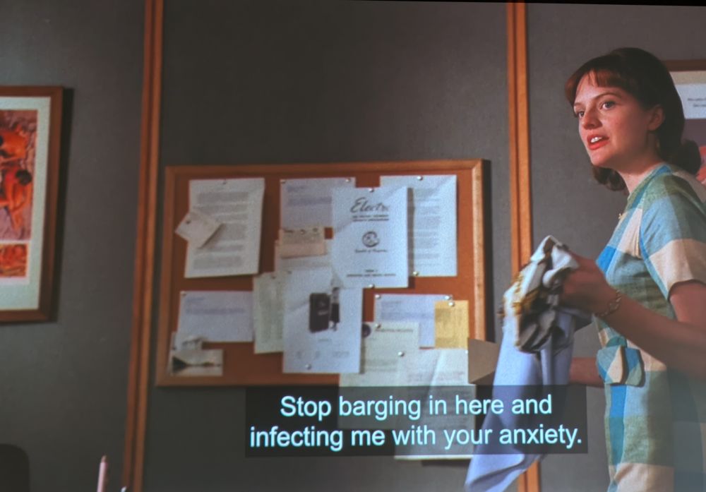 Screenshot of Elizabeth Moss as Peggy in Mad Men, with the caption "Stop barging in here and infecting me with your anxiety."