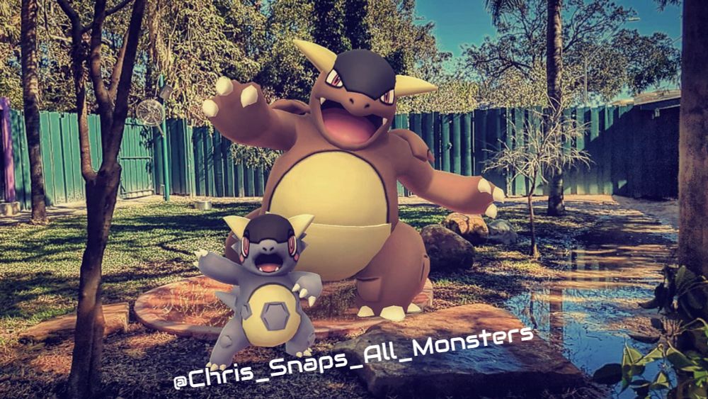 A snapshot of the Mega Pokémon Kangaskhan inside the Kangaloom habitat at Busch Gardens Tampa Bay, where both the parent and child that make up this Pokémon are waving to the camera.