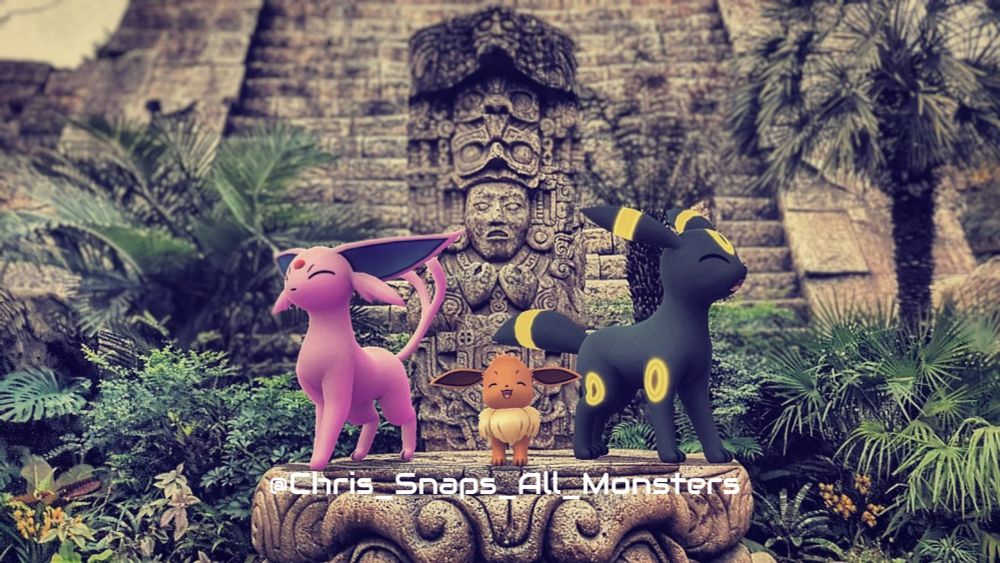 A snapshot of the Pokémon Espeon, Eevee, and Umbreon perched on a stone in front of the Aztec pyramid at Tokyo DisneySea.