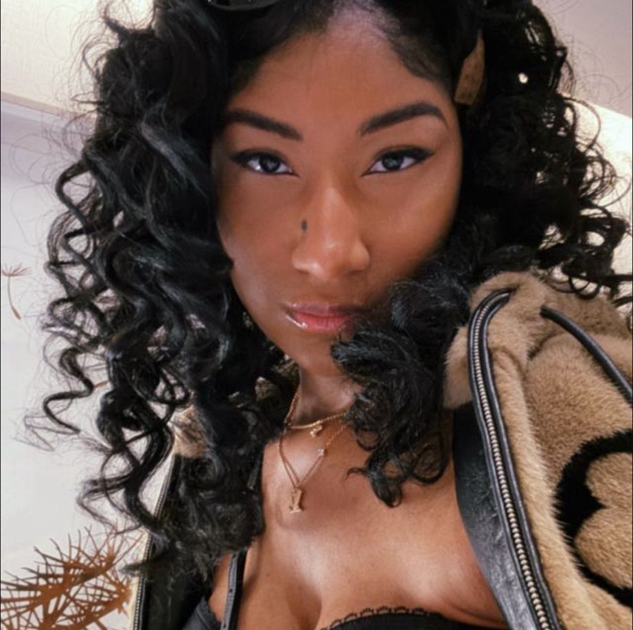 A photo of the poster, ceviche, staring straight into the camera with intense eyes, and a flat expression.