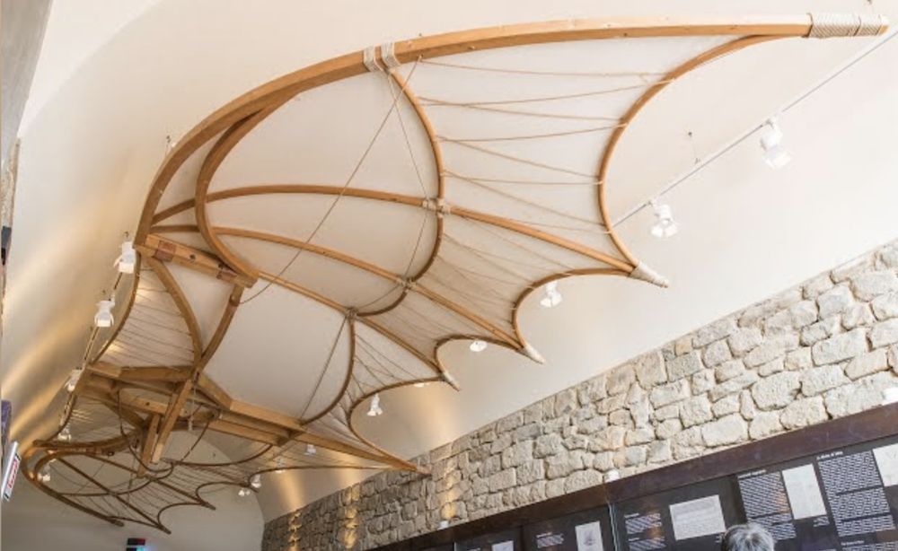 image of a wooden reconstruction of Leonardo's sketch of a flying machine looks like wooden bird wings