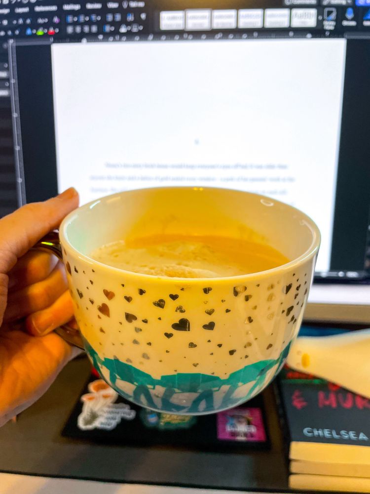 At-At coffee mug in front of open screen with words that need editing!